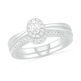 0.29 CT. T.W. Oval Diamond Frame Bridal Set in 10K White Gold