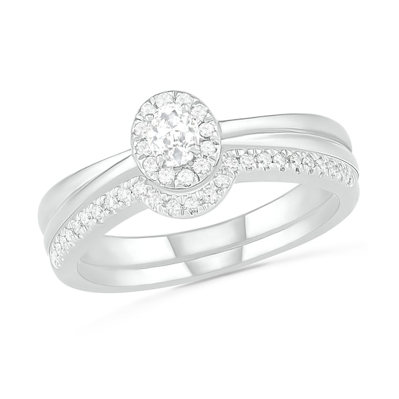 0.29 CT. T.W. Oval Diamond Frame Bridal Set in 10K White Gold