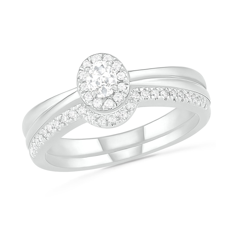 0.29 CT. T.W. Oval Diamond Frame Bridal Set in 10K White Gold