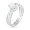 0.29 CT. T.W. Oval Diamond Frame Bridal Set in 10K White Gold