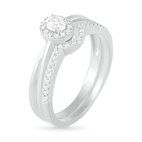 0.29 CT. T.W. Oval Diamond Frame Bridal Set in 10K White Gold