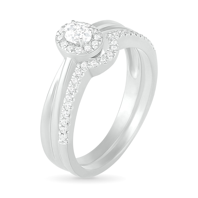 0.29 CT. T.W. Oval Diamond Frame Bridal Set in 10K White Gold