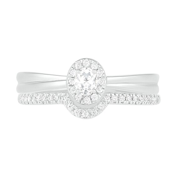 0.29 CT. T.W. Oval Diamond Frame Bridal Set in 10K White Gold