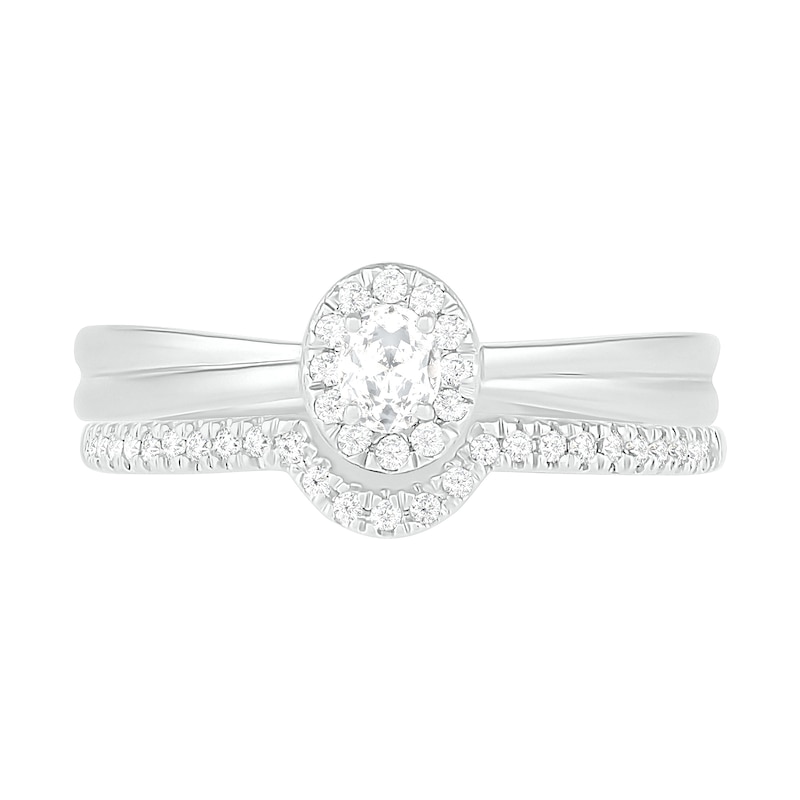 0.29 CT. T.W. Oval Diamond Frame Bridal Set in 10K White Gold