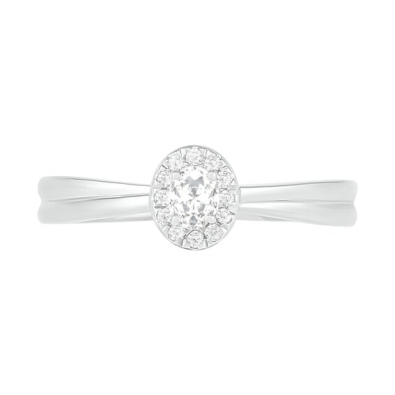 0.29 CT. T.W. Oval Diamond Frame Bridal Set in 10K White Gold