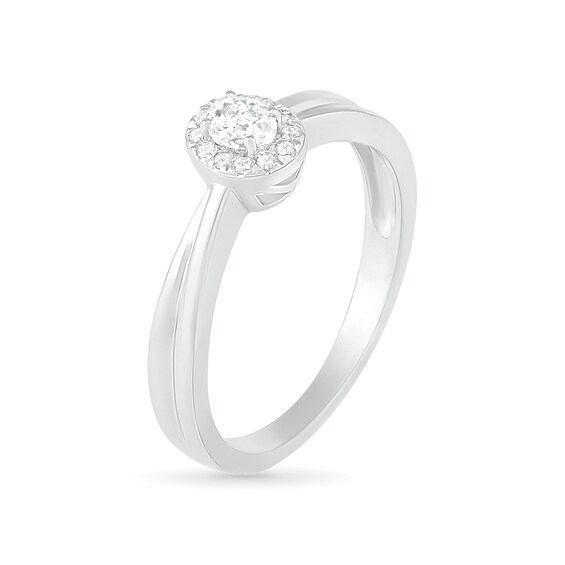 0.29 CT. T.W. Oval Diamond Frame Bridal Set in 10K White Gold