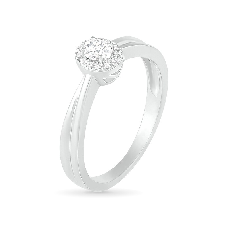 0.29 CT. T.W. Oval Diamond Frame Bridal Set in 10K White Gold