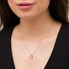 Thumbnail Image 1 of Ruby and Diamond Accent Tilted Loop Heart Outline Pendant in 10K Rose Gold