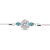 Enchanted Disney Cinderella Pear-Shaped London Blue Topaz and 0.085 CT. T.W. Diamond Bolo Bracelet in Sterling Silver - 9"