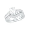 Thumbnail Image 0 of Oval White Lab-Created Sapphire Bypass Bridal Set in Sterling Silver