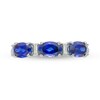 Oval Lab-Created Blue Sapphire and Baguette Diamond Accent Three Stone Ring in Sterling Silver