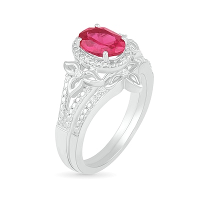 Oval Lab-Created Ruby and 0.065 CT. T.W. Diamond Bead Frame Flower-Sides Split Shank Bridal Set in Sterling Silver