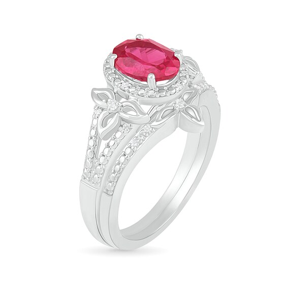 Oval Lab-Created Ruby and 0.065 CT. T.W. Diamond Bead Frame Flower-Sides Split Shank Bridal Set in Sterling Silver