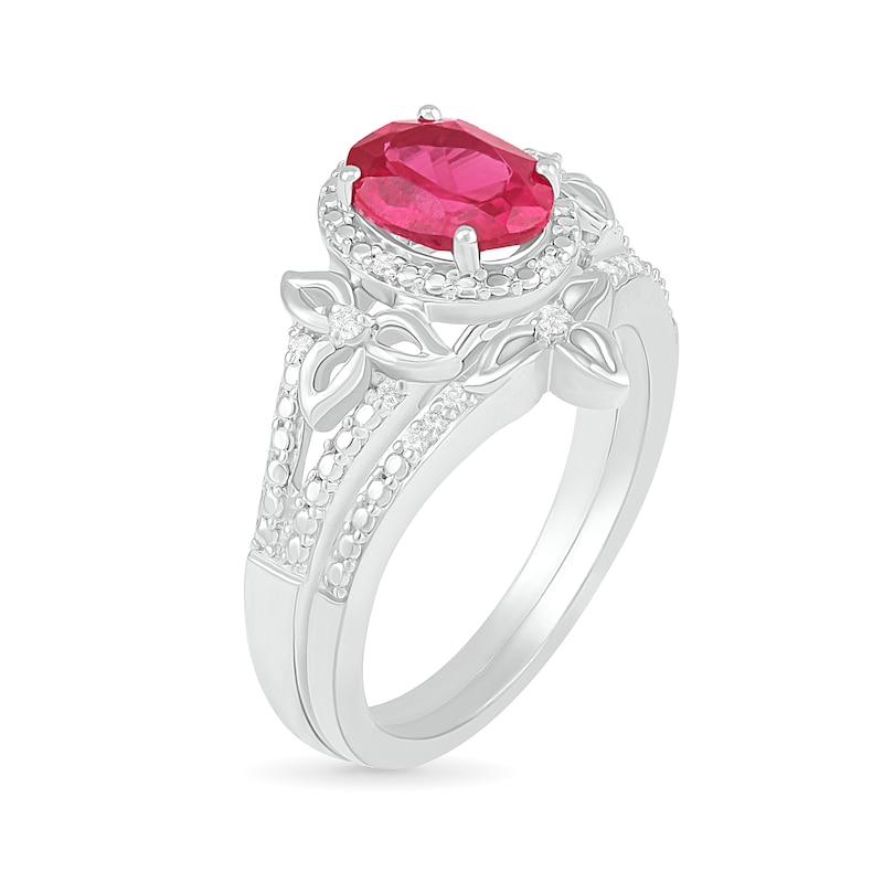 Oval Lab-Created Ruby and 0.065 CT. T.W. Diamond Bead Frame Flower-Sides Split Shank Bridal Set in Sterling Silver