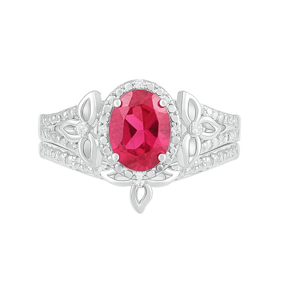 Oval Lab-Created Ruby and 0.065 CT. T.W. Diamond Bead Frame Flower-Sides Split Shank Bridal Set in Sterling Silver