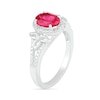 Oval Lab-Created Ruby and 0.065 CT. T.W. Diamond Bead Frame Flower-Sides Split Shank Bridal Set in Sterling Silver