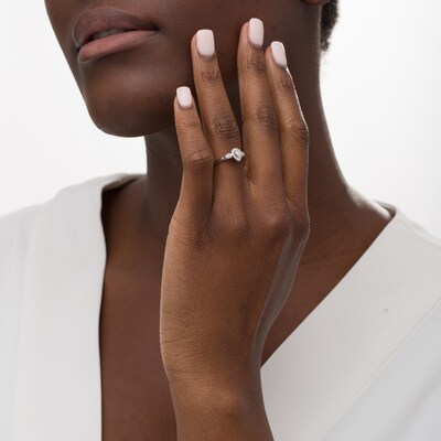 0.16 CT. T.W. Pear-Shaped Diamond Frame Promise Ring in 10K White Gold