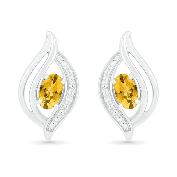 Oval Citrine and 0.04 CT. T.W. Diamond Bypass Flame Stud Earrings in Sterling Silver
