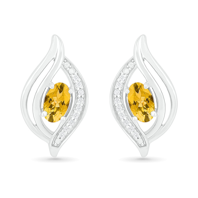 Oval Citrine and 0.04 CT. T.W. Diamond Bypass Flame Stud Earrings in Sterling Silver