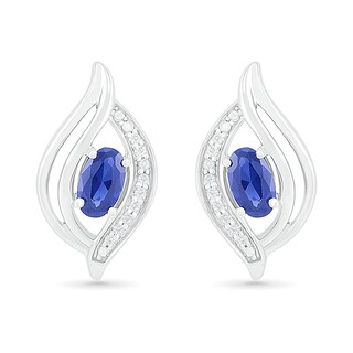 Oval Blue Lab-Created Sapphire and 0.04 CT. T.W. Diamond Bypass Flame Stud Earrings in Sterling Silver