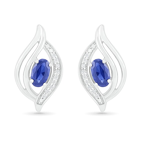 Oval Blue Lab-Created Sapphire and 0.04 CT. T.W. Diamond Bypass Flame Stud Earrings in Sterling Silver
