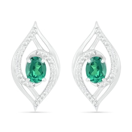 Lab-Created Oval Emerald and 0.067 CT. T.W. Diamond Bypass Flame Stud Earrings in Sterling Silver