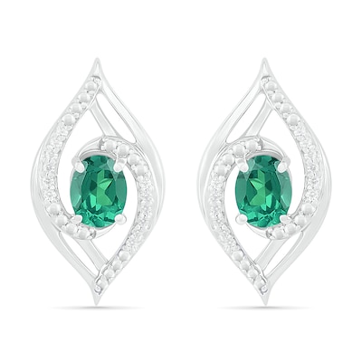 Lab-Created Oval Emerald and 0.067 CT. T.W. Diamond Bypass Flame Stud Earrings in Sterling Silver