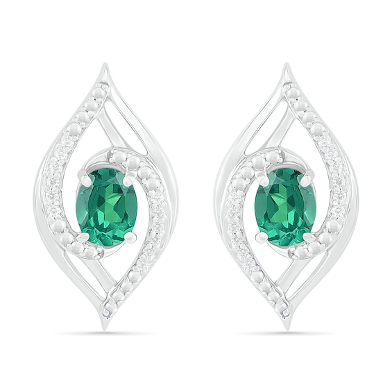 Lab-Created Oval Emerald and 0.067 CT. T.W. Diamond Bypass Flame Stud Earrings in Sterling Silver