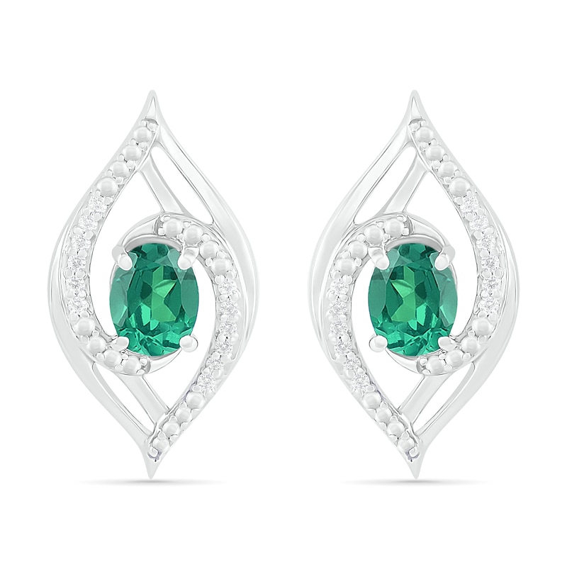 Main Image 1 of Lab-Created Oval Emerald and 0.067 CT. T.W. Diamond Bypass Flame Stud Earrings in Sterling Silver