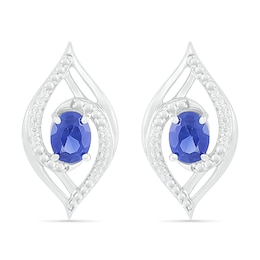 Oval Blue Lab-Created Sapphire and 0.067 CT. T.W. Diamond Bypass Flame Stud Earrings in Sterling Silver