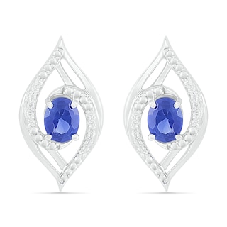 Oval Blue Lab-Created Sapphire and 0.067 CT. T.W. Diamond Bypass Flame Stud Earrings in Sterling Silver