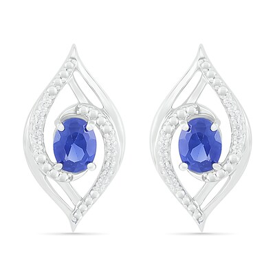 Oval Blue Lab-Created Sapphire and 0.067 CT. T.W. Diamond Bypass Flame Stud Earrings in Sterling Silver