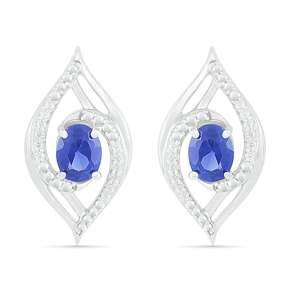 Oval Blue Lab-Created Sapphire and 0.067 CT. T.W. Diamond Bypass Flame Stud Earrings in Sterling Silver
