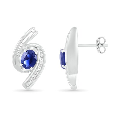 Oval Blue Lab-Created Sapphire and 0.04 CT. T.W. Diamond Bypass Ribbon Stud Earrings in Sterling Silver