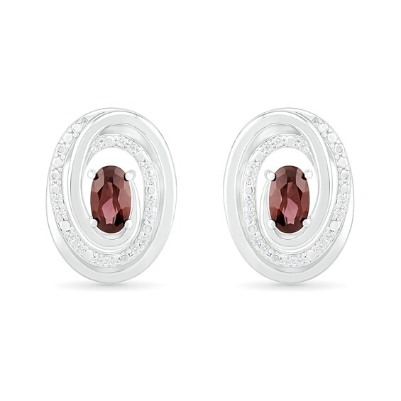 Oval Garnet and 0.066 CT. T.W. Diamond Beaded Open Swirl Frame Stud Earrings in Sterling Silver