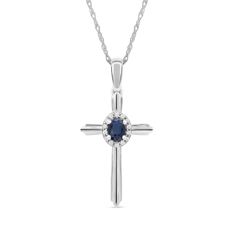 Oval Blue Sapphire and 0.04 CT. T.W. Diamond Frame Layered Cross Pendant in 10K White Gold|Peoples Jewellers