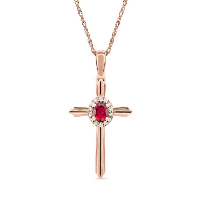 Oval Ruby and 0.04 CT. T.W. Diamond Frame Layered Cross Pendant in 10K Rose Gold|Peoples Jewellers