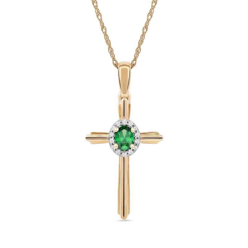 Oval Emerald and 0.04 CT. T.W. Diamond Frame Layered Cross Pendant in 10K Gold