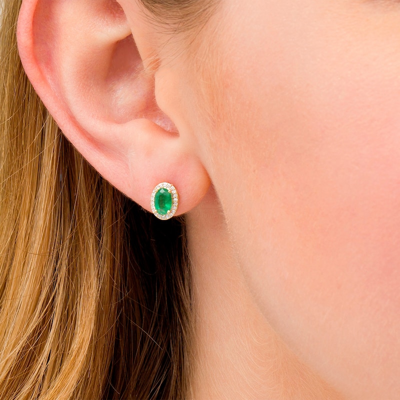 Main Image 2 of Oval Emerald and 0.088 CT. T.W. Diamond Frame Stud Earrings in 10K Gold