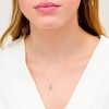 Thumbnail Image 2 of Oval Emerald and 0.08 CT. T.W. Diamond Frame Twist Drop Pendant in 10K Gold