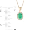 Thumbnail Image 3 of Oval Emerald and 0.08 CT. T.W. Diamond Frame Twist Drop Pendant in 10K Gold