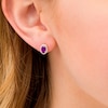 Thumbnail Image 1 of Oval Amethyst and 0.088 CT. T.W. Diamond Frame Stud Earrings in 10K Gold