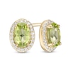 Thumbnail Image 1 of Oval Peridot and 0.088 CT. T.W. Diamond Frame Stud Earrings in 10K Gold