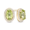 Thumbnail Image 0 of Oval Peridot and 0.088 CT. T.W. Diamond Frame Stud Earrings in 10K Gold