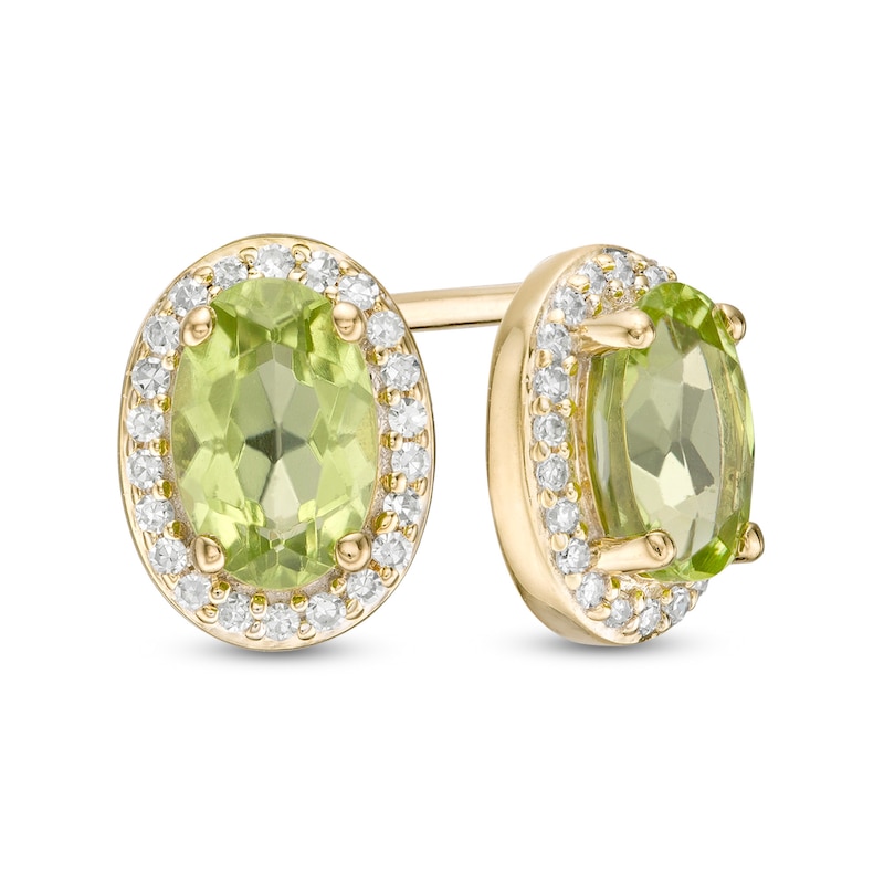 Oval Peridot and 0.088 CT. T.W. Diamond Frame Stud Earrings in 10K Gold