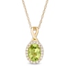 Thumbnail Image 0 of Oval Peridot and 0.08 CT. T.W. Diamond Frame Twisted Split Bail Pendant in 10K Gold