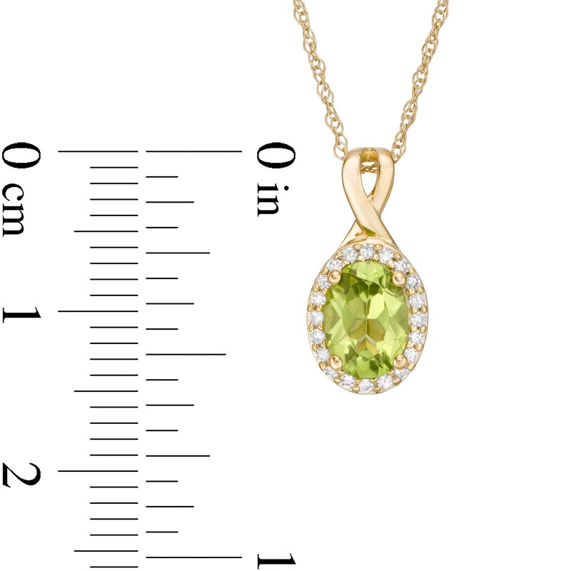 Main Image 3 of Oval Peridot and 0.08 CT. T.W. Diamond Frame Twisted Split Bail Pendant in 10K Gold