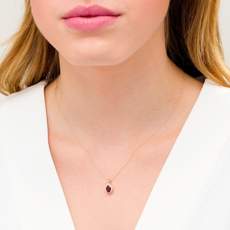 Main Image 2 of Oval Garnet and 0.08 CT. T.W. Diamond Frame Twisted Split Bail Pendant in 10K Gold