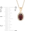 Thumbnail Image 3 of Oval Garnet and 0.08 CT. T.W. Diamond Frame Twisted Split Bail Pendant in 10K Gold