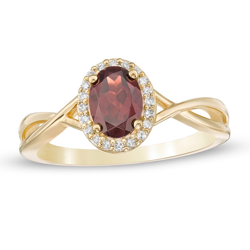 Oval Garnet and 0.08 CT. T.W. Diamond Frame Twist Shank Ring in 10K Gold